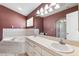 Bathroom featuring a soaking tub and double sinks in a classic design at 2329 Towering Oaks Cir, Seffner, FL 33584