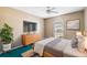 Bright bedroom featuring a comfortable bed, large window, and modern furniture for a peaceful retreat at 2329 Towering Oaks Cir, Seffner, FL 33584