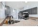 Kitchen featuring gray cabinets, stainless steel appliances and double sink at 2329 Towering Oaks Cir, Seffner, FL 33584
