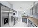 Updated kitchen featuring stainless steel appliances and bar seating at 2329 Towering Oaks Cir, Seffner, FL 33584