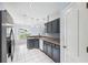 Kitchen featuring gray cabinets, stainless steel appliances, and tiled floors at 2329 Towering Oaks Cir, Seffner, FL 33584
