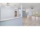 Open-concept living area featuring tile flooring and a seamless transition to other rooms at 2329 Towering Oaks Cir, Seffner, FL 33584