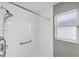 Shower features a shower head, grab bar and convenient built-in shelving at 2329 Towering Oaks Cir, Seffner, FL 33584