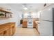 Well-lit kitchen with white cabinets, butcher block countertops, and modern appliances for a delightful cooking experience at 2461 Rhodesian Dr # 45, Clearwater, FL 33763