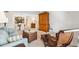 Relaxing living room with wicker accents, a blue couch, and an open layout to the dining area for easy living at 2461 Rhodesian Dr # 45, Clearwater, FL 33763