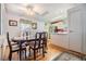 Dining room with a wooden table, chandelier, and ceiling fan at 36328 Bonney Dr, Zephyrhills, FL 33541