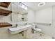 Modern bathroom featuring an elongated sink, wooden shelves, and glass-enclosed shower at 36750 Us 19 N # 08102, Palm Harbor, FL 34684