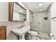 Bathroom featuring shower with glass door, and pedestal sink at 36750 Us 19 N # 08102, Palm Harbor, FL 34684