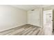 Unfurnished bedroom shows light-colored laminate flooring and a white sliding-door closet at 36750 Us 19 N # 08102, Palm Harbor, FL 34684