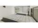 Bedroom featuring two beds with neutral paint and natural lighting at 36750 Us 19 N # 08102, Palm Harbor, FL 34684