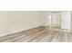 Unfurnished bedroom shows light-colored laminate flooring with white walls and doors at 36750 Us 19 N # 08102, Palm Harbor, FL 34684
