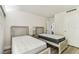Bedroom featuring two beds with neutral paint and natural lighting at 36750 Us 19 N # 08102, Palm Harbor, FL 34684