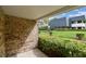 Brick wall exterior of building with landscaped green space at 36750 Us 19 N # 08102, Palm Harbor, FL 34684