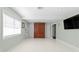 Bonus room with built in cabinet, tv and ample closet space at 4506 W Beachway Dr, Tampa, FL 33609