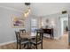 Dining room features modern light fixture and wood-look laminate flooring at 4506 W Beachway Dr, Tampa, FL 33609