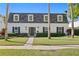 Charming two-story home with a well-manicured lawn and classic architectural details at 4506 W Beachway Dr, Tampa, FL 33609