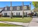 Charming two-story home with a well-manicured lawn and classic architectural details at 4506 W Beachway Dr, Tampa, FL 33609
