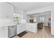 Bright, updated kitchen features stainless steel appliances and white cabinets at 4506 W Beachway Dr, Tampa, FL 33609