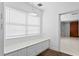 Bright laundry area with built-in bench and storage, next to closet at 4506 W Beachway Dr, Tampa, FL 33609