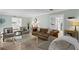 Spacious living room with a fireplace, stylish furniture, and ample natural light at 4506 W Beachway Dr, Tampa, FL 33609