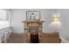 Living room with rustic stone fireplace, wood mantle, and decor at 4506 W Beachway Dr, Tampa, FL 33609