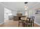 Open-concept living space with a dining area and kitchen bar at 4506 W Beachway Dr, Tampa, FL 33609