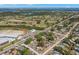 Birds eye view of a single-story home located near golf course, schools, and a small body of water at 501 61St Ne Ave, St Petersburg, FL 33703