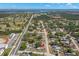 Aerial view of a residential area, with a single-story home with fenced in yard and a pool shown at 501 61St Ne Ave, St Petersburg, FL 33703