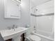 Updated bathroom with white subway tiles and a pedestal sink, featuring unfinished wall renovations at 501 61St Ne Ave, St Petersburg, FL 33703