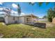 This home features a cozy backyard with a covered patio and ample yard space at 5411 96Th N Ter, Pinellas Park, FL 33782