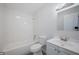 Bathroom featuring white tiled walls, modern fixtures, and plenty of counter space at 5411 96Th N Ter, Pinellas Park, FL 33782