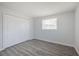 The bedroom offers closet space and natural light from the windows at 5411 96Th N Ter, Pinellas Park, FL 33782