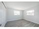 This bedroom features a window and a closet and wood flooring at 5411 96Th N Ter, Pinellas Park, FL 33782