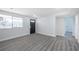 Inviting living area featuring modern gray floors and fresh paint, creating a clean aesthetic at 5411 96Th N Ter, Pinellas Park, FL 33782