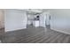 Bright, open living space featuring sleek gray floors and a seamless flow into the kitchen at 5411 96Th N Ter, Pinellas Park, FL 33782