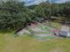 Overhead shot of mini golf course with surrounding trees and seating at 5546 Benton St, Zephyrhills, FL 33542