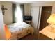 Cozy bedroom with natural light, TV, and closet at 5546 Benton St, Zephyrhills, FL 33542