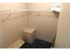 A simple closet space with a storage unit and wire shelving at 5546 Benton St, Zephyrhills, FL 33542