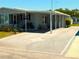 Inviting single-story home features a covered carport with a unique star design on the driveway at 5546 Benton St, Zephyrhills, FL 33542