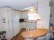Well-designed kitchen includes ample cabinetry, an efficient appliance package, and a breakfast bar at 5546 Benton St, Zephyrhills, FL 33542