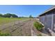 Expansive backyard featuring a chain-link fence and views of lush greenery at 672 Allegheny Dr, Sun City Center, FL 33573