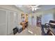 Bedroom features two closets, a desk and neutral carpeting at 672 Allegheny Dr, Sun City Center, FL 33573