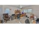 Bedroom featuring neutral carpeting, built-in desk, and two windows at 672 Allegheny Dr, Sun City Center, FL 33573