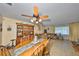 Dining area with ceiling fan and views into living room at 672 Allegheny Dr, Sun City Center, FL 33573
