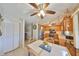 Cozy kitchen and dining area with stainless steel appliances, tile flooring, and wood cabinetry at 672 Allegheny Dr, Sun City Center, FL 33573
