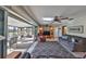 Bright living room featuring sliding doors to a screened lanai and comfortable seating at 672 Allegheny Dr, Sun City Center, FL 33573