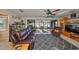 Comfortable living room with sliding glass doors opening to a screened lanai at 672 Allegheny Dr, Sun City Center, FL 33573