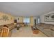 Comfortable living room with hardwood floors, neutral colors, and ample seating at 672 Allegheny Dr, Sun City Center, FL 33573