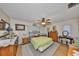 Comfortable main bedroom with wood floors, dresser, and ample closet space at 672 Allegheny Dr, Sun City Center, FL 33573