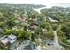 Aerial view showcasing the property's location with lush surroundings and waterfront access at 705 S West Shore Blvd, Tampa, FL 33609